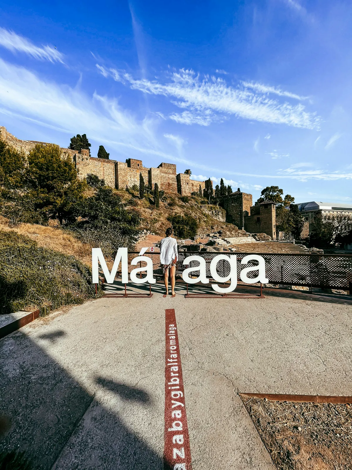 Malaga sign beside the Roman Theatre and Alcazaba